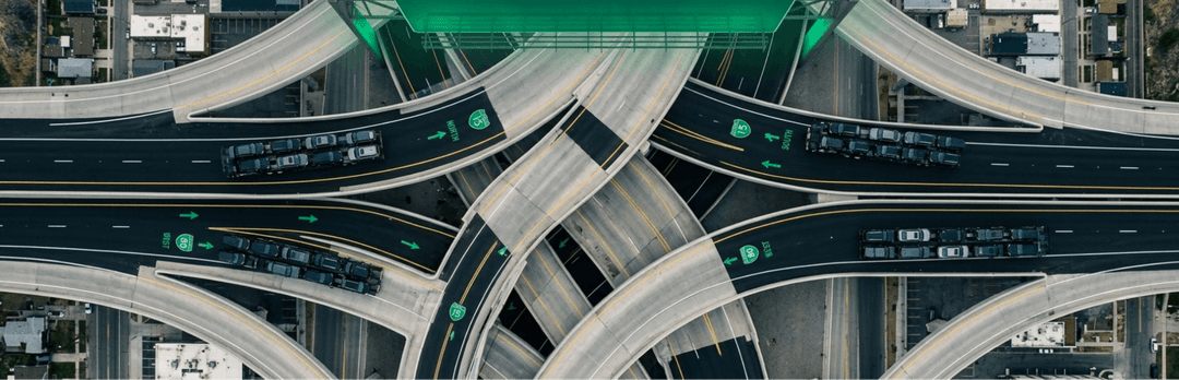 Aerial view of a multi-level highway interchange marking busy freight routes